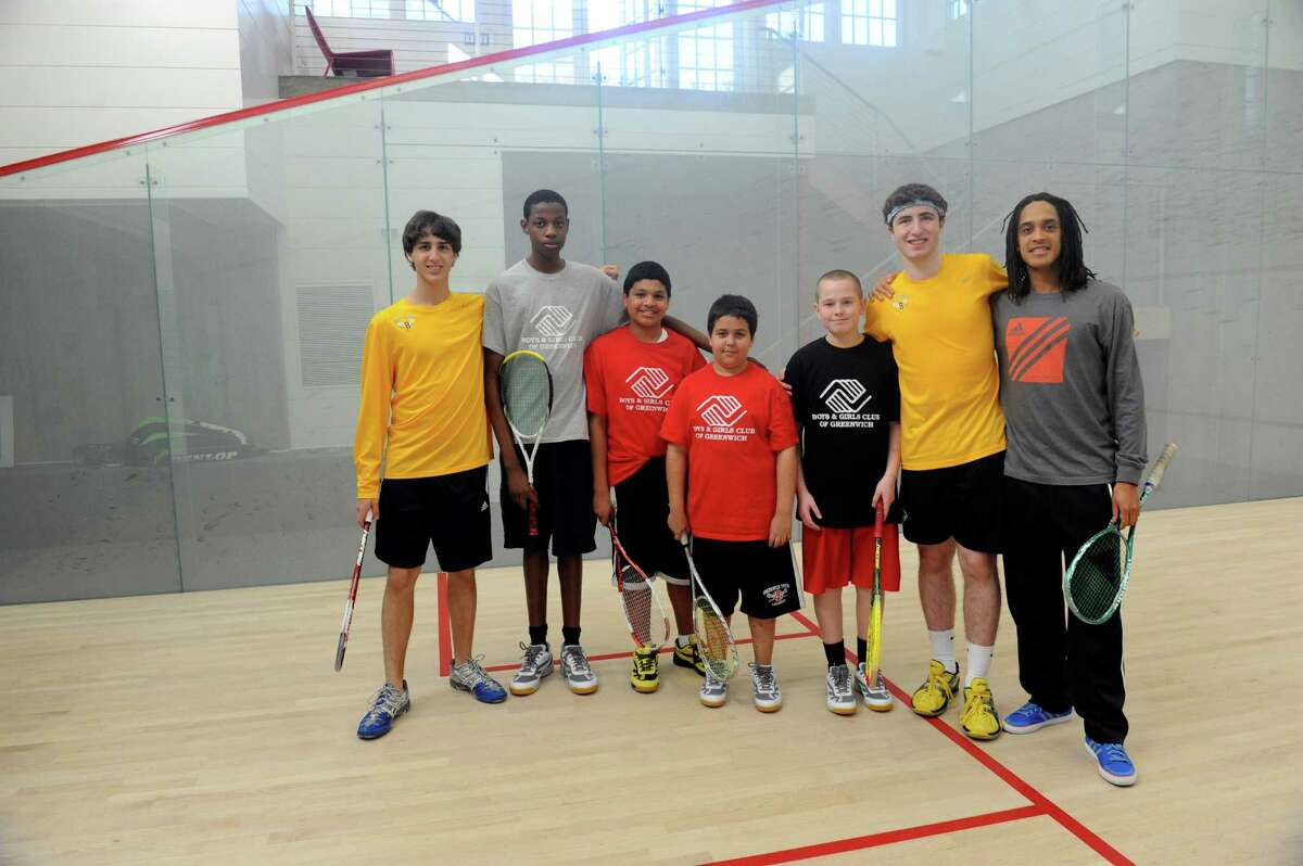 From left: Jarret Odrich, 15, Karl Souffrant, 14, Jose Romero, 13, Matt Dutra, 10, Jeff Barter, 13, Parker Odrich, 17 and professional squash player Alister Walker pose for a picture April 4, 2012. Parker and Jarret, students at Brunswick School, started Learn to Squash, a program that teaches children and youth from the Boys & Girls Club how to play squash.
