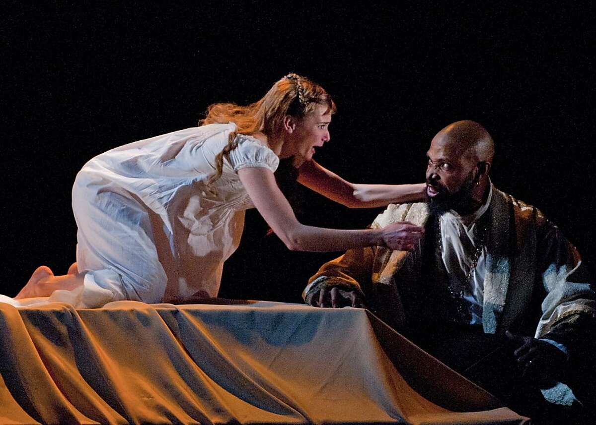 Desdemona (Mairin Lee) pleads for her life against the jealous rage of her husband Othello (Aldo Billingslea) in Marin Theatre Company's "Othello, the Moor of Venice"