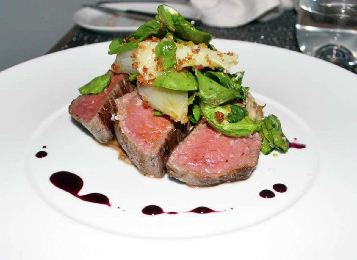 A beef tenderloin is featured on the menu.