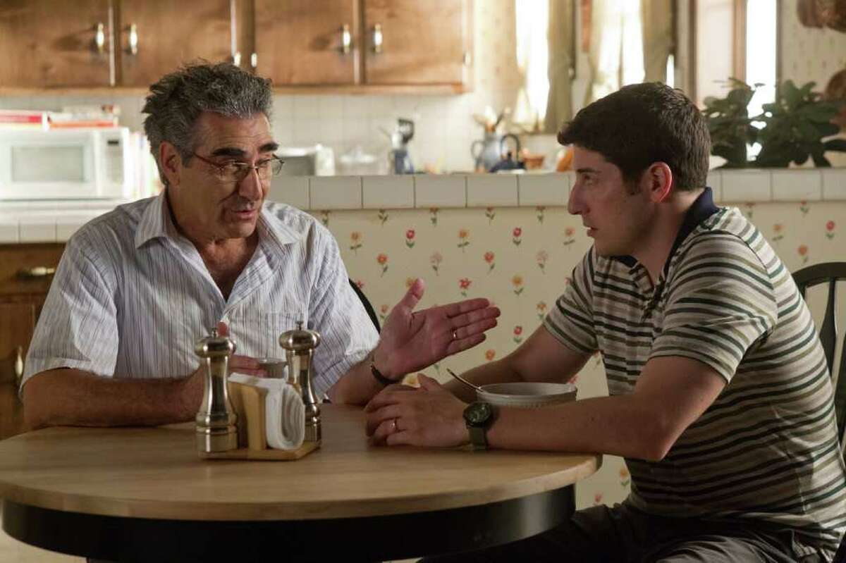In this image released by Universal Pictures, Eugene Levy, left, and Jason Biggs are shown in a scene from "American Reunion". (AP Photo/Universal Pictures, Hopper Stone)