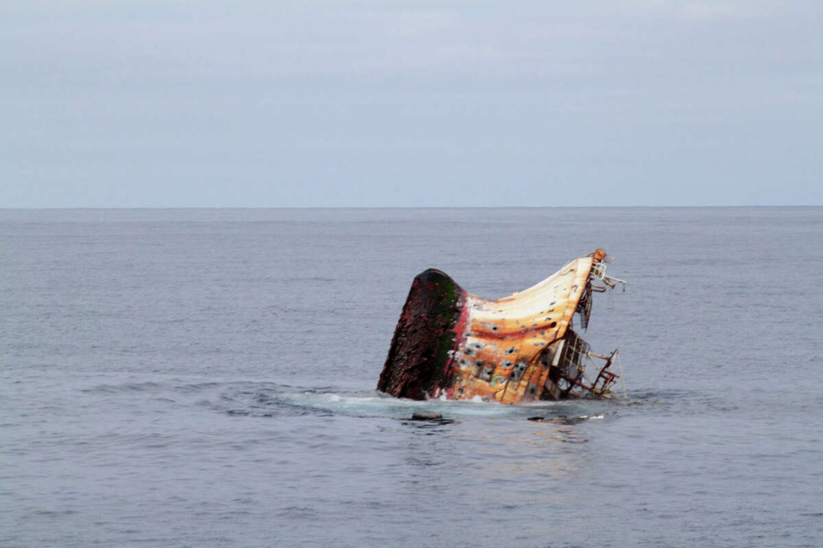 The rusted bottom of the Japanese fishing vessel Ryou-Un Maru is exposed as the vessel sinks in the Gulf of Alaska more than 180 miles southwest of Sitka, Alaska, April 5, 2012. The Coast Guard worked closely with federal, state and local agencies to assess the immediate dangers the vessel presented and determined that sinking the vessel at sea would be the best course of action to help minimize any navigation and environmental threats.