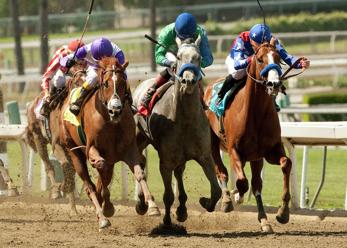 I'll Have Another, left, ridden by Mario Gutierrez, outruns Creative Cause, center, and Blueskiesnrainbows to win the Santa Anita Derby on Saturday at Arcadia, Calif. The race is the West's leading prep for the Kentucky Derby.