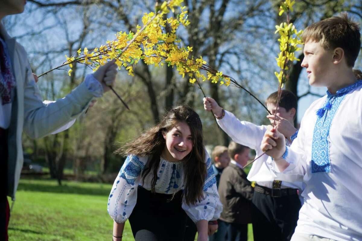 Emily Lencyk and other children of the School of Ukrainian Studies celebrate Easter Sunday with a performance of "Hailky-Vesnianky" outside St. Volodymyr's Ukrainian Catholic Cathedral in Stamford, Conn., April 8, 2012. In pre-Christian times, Hailky were believed to have the magical power of enticing spring. The songs and dances are drawn from nature and are believed to bring luck and wealth.