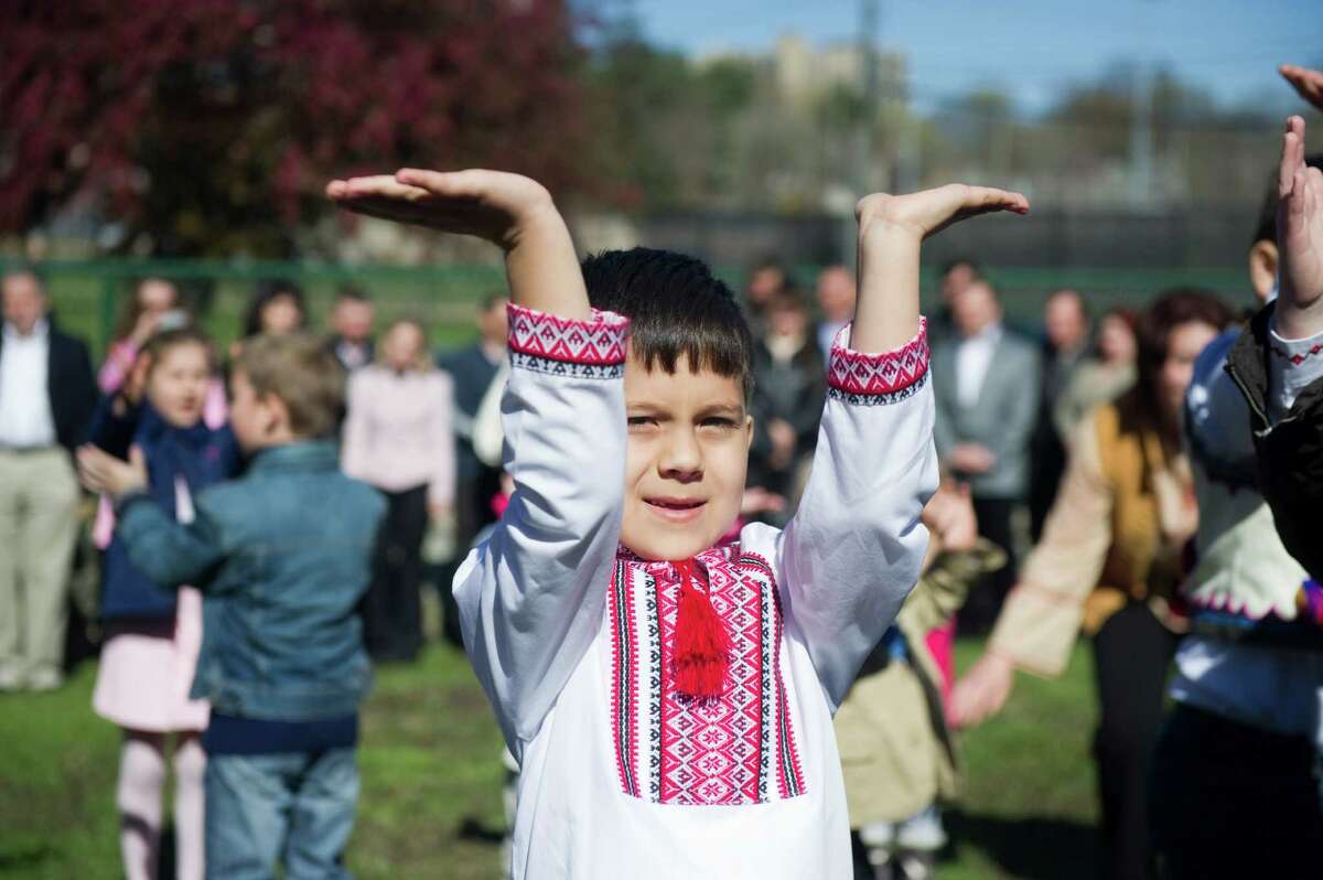 Adrian Kozyuk and other children of the School of Ukrainian Studies celebrate Easter Sunday with a performance of "Hailky-Vesnianky" outside St. Volodymyr's Ukrainian Catholic Cathedral in Stamford, Conn., April 8, 2012. In pre-Christian times, Hailky were believed to have the magical power of enticing spring. The songs and dances are drawn from nature and are believed to bring luck and wealth.