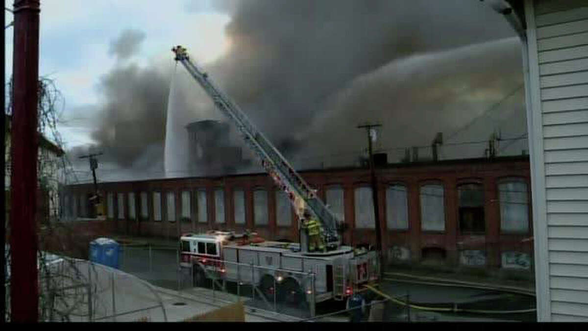 Huge factory fire continues to burn