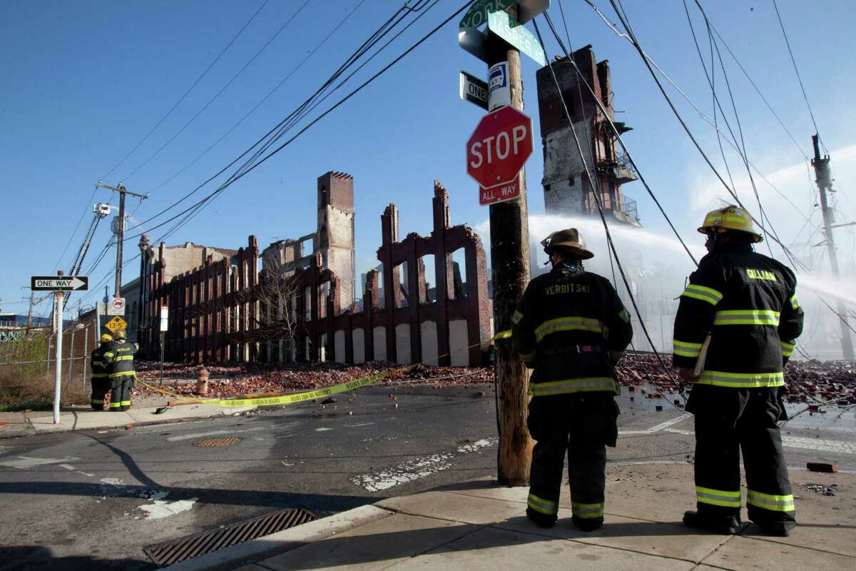 News Of The World In Photos: Blaze Kills Philadelphia Firefighters