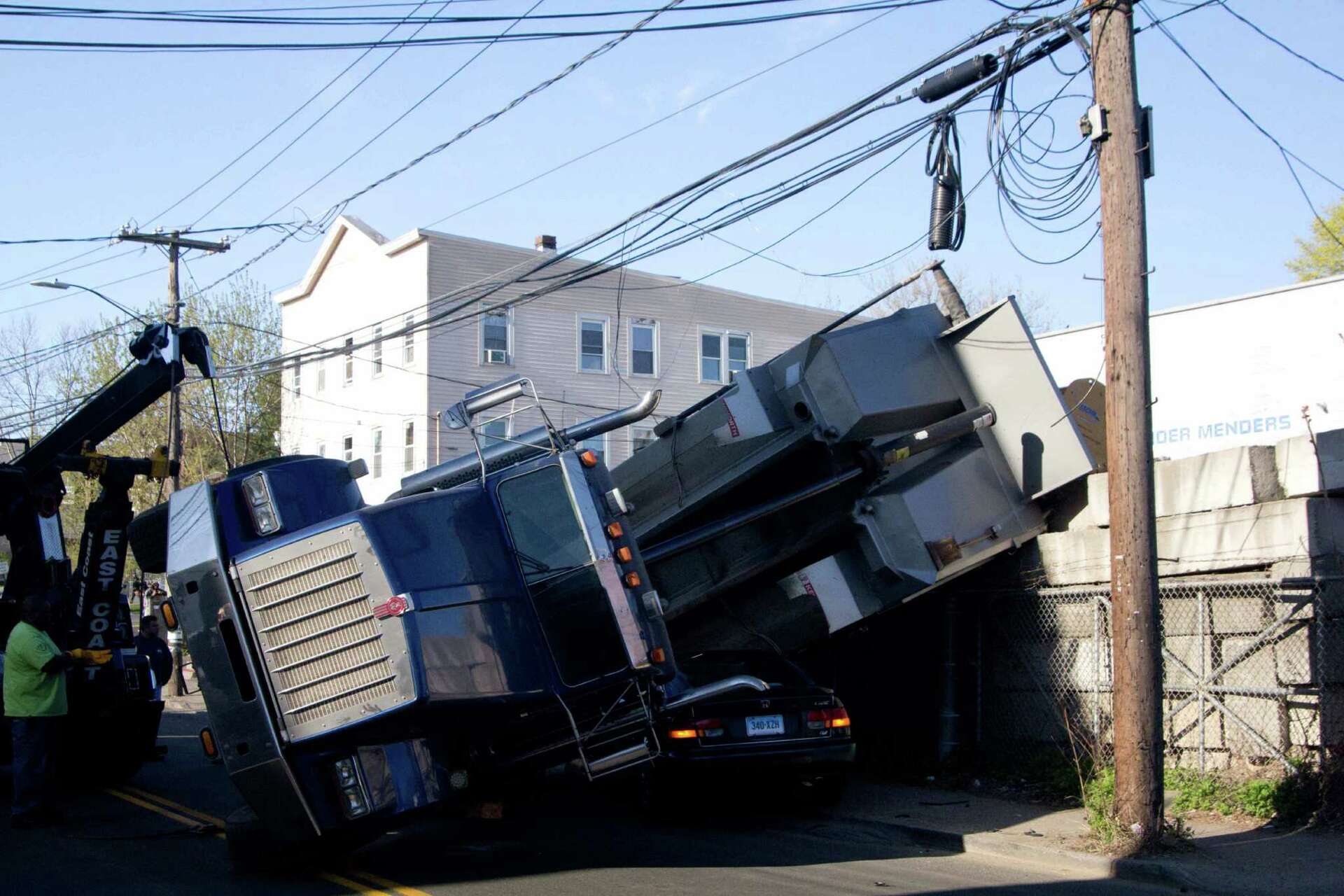 Truck rolls over, takes down wires in Stamford
