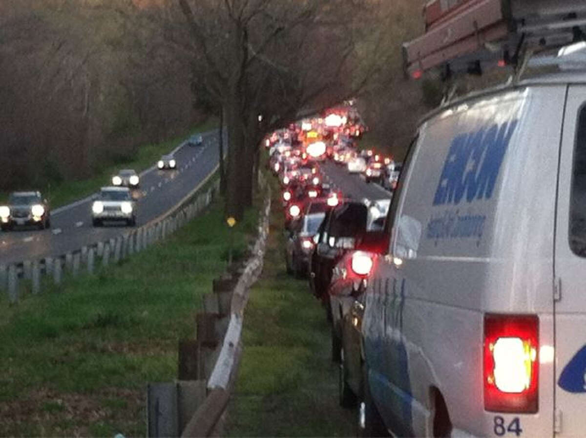 Traffic on the Merritt Parkway sits at a standstill following an accident Friday evening between extis 35 and 36 northbound.