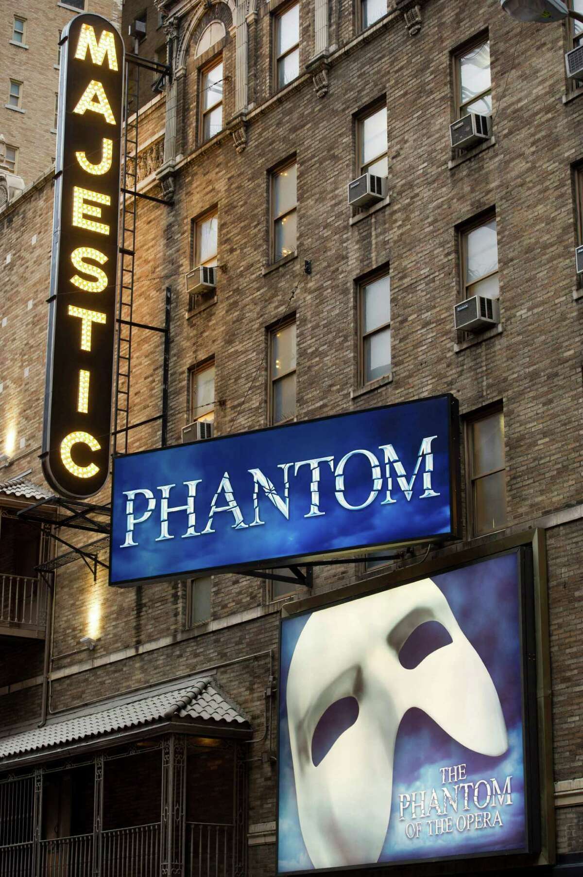 FILE - In this Jan. 19, 2012 file photo, the Majestic Theatre and the marquee for "The Phantom of the Opera" are seen in New York. Box office revenues show that "The Lion King" has recently swiped the title of Broadway's all-time highest grossing show from "The Phantom of the Opera." (AP Photo/Charles Sykes, File)