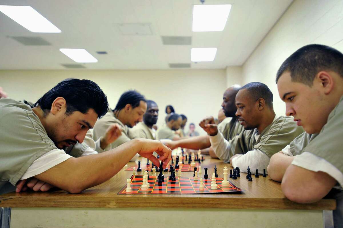 Cook County inmates play chess in a program implemented by Sheriff Tom Dart. He introduced the program in hopes that inmates can learn from a game that rewards patience and problem solving.