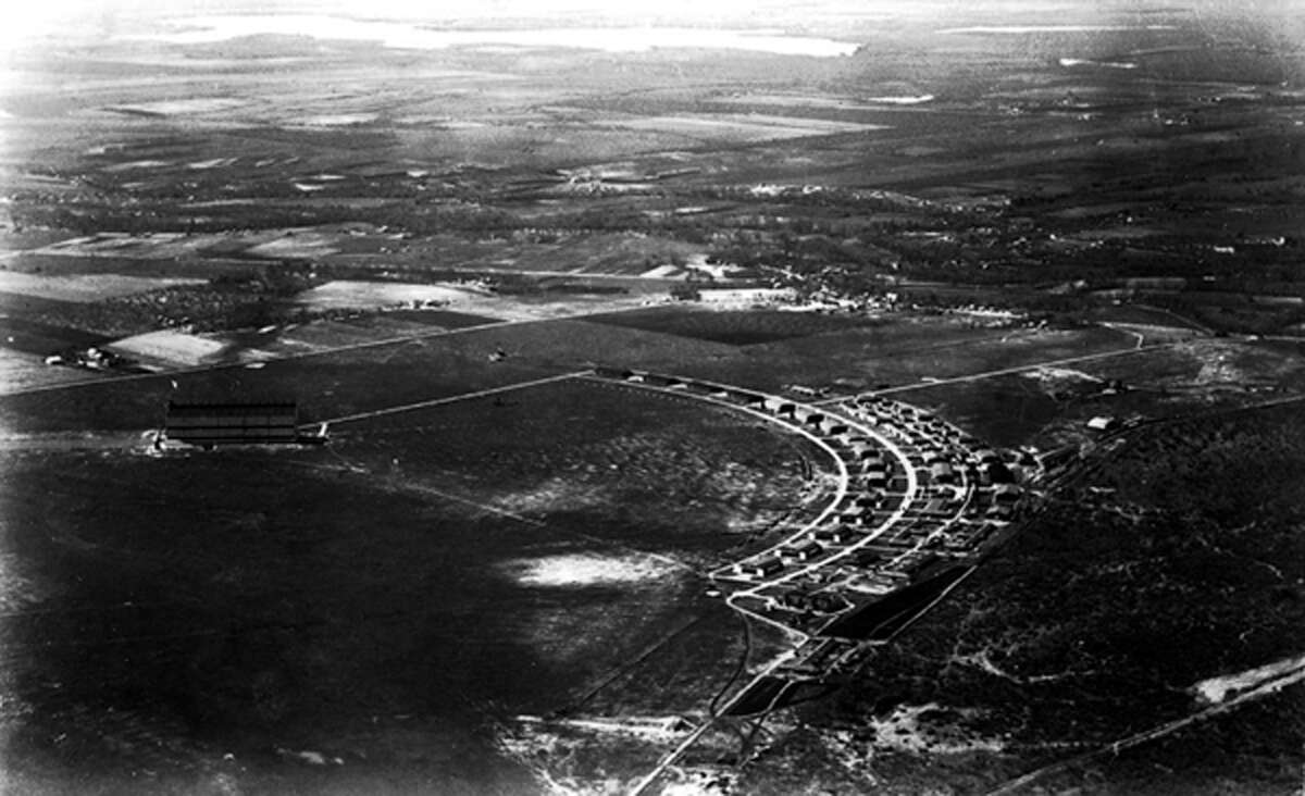 This aerial photo taken in 1924 shows a row of World War I hangars built at Brooks Field in 1918. According to the 1970 statement nominating Hangar 9 as a national landmark, the 16 hangars formed a "segmental arc flanking the north side of a northeast-southwest dirt runway."