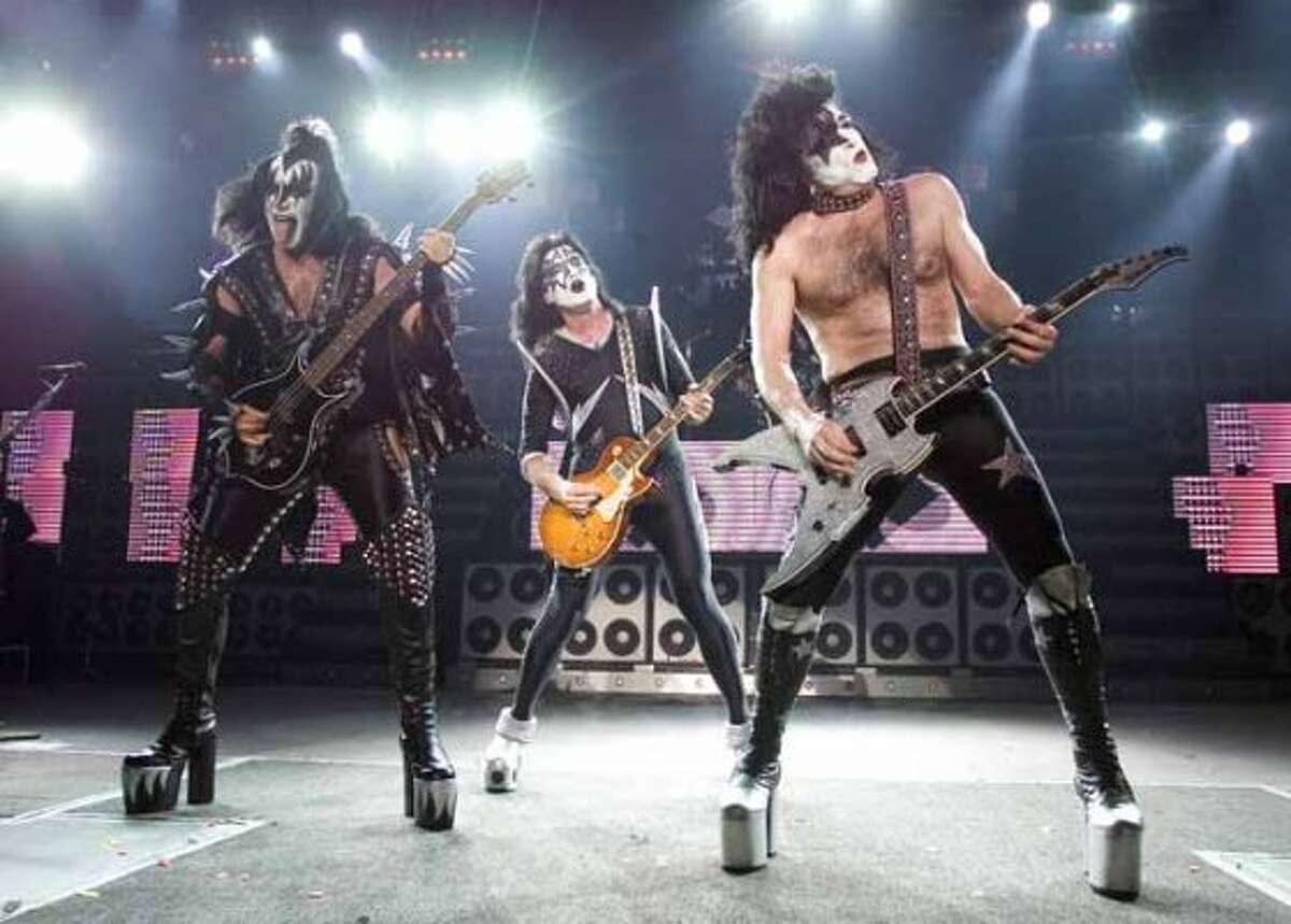 The rock band Kiss, from left, Gene Simmons, Tommy Thayer and Paul Stanley perform during their performance at the PNC Bank Arts Center in Holmdel, N.J. on Tuesday, July 20, 2004. (AP Photo/Christopher Barth) (AP)