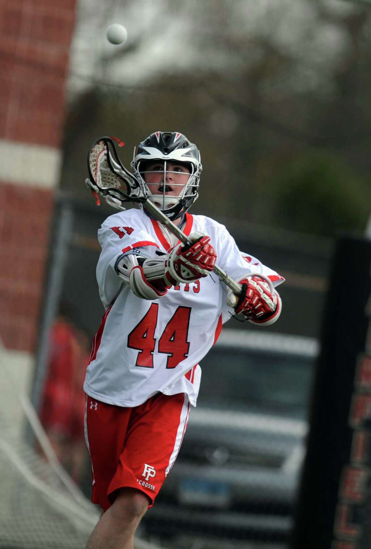 Fairfield Prep's Jack Arrix passes the ball during their match against Cheshire Tuesday, April 10, 2012 at Alumni Field on the campus of Fairfield University.