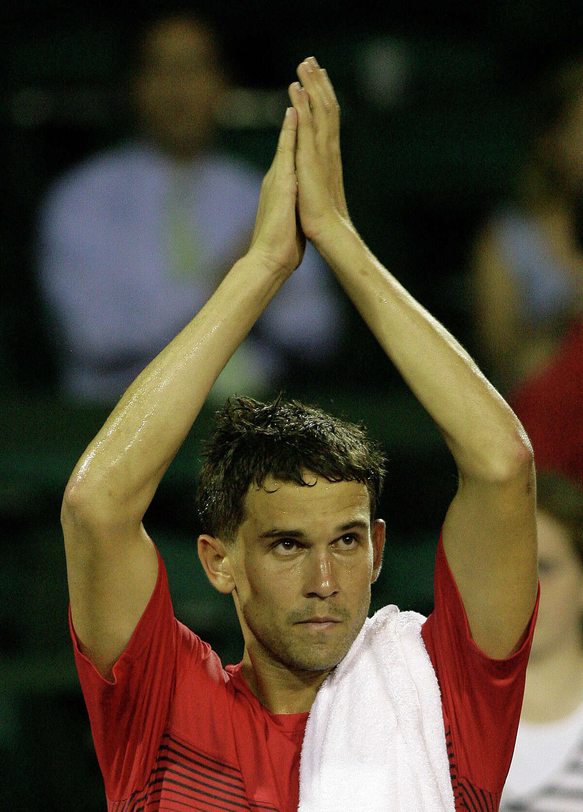 Ryan Sweeting reacts after defeating Ricardo Mello during a singles match at River Oaks Country Club Tuesday, April 10, 2012, in Houston. Sweeting won 6-3, 7-6 (6).