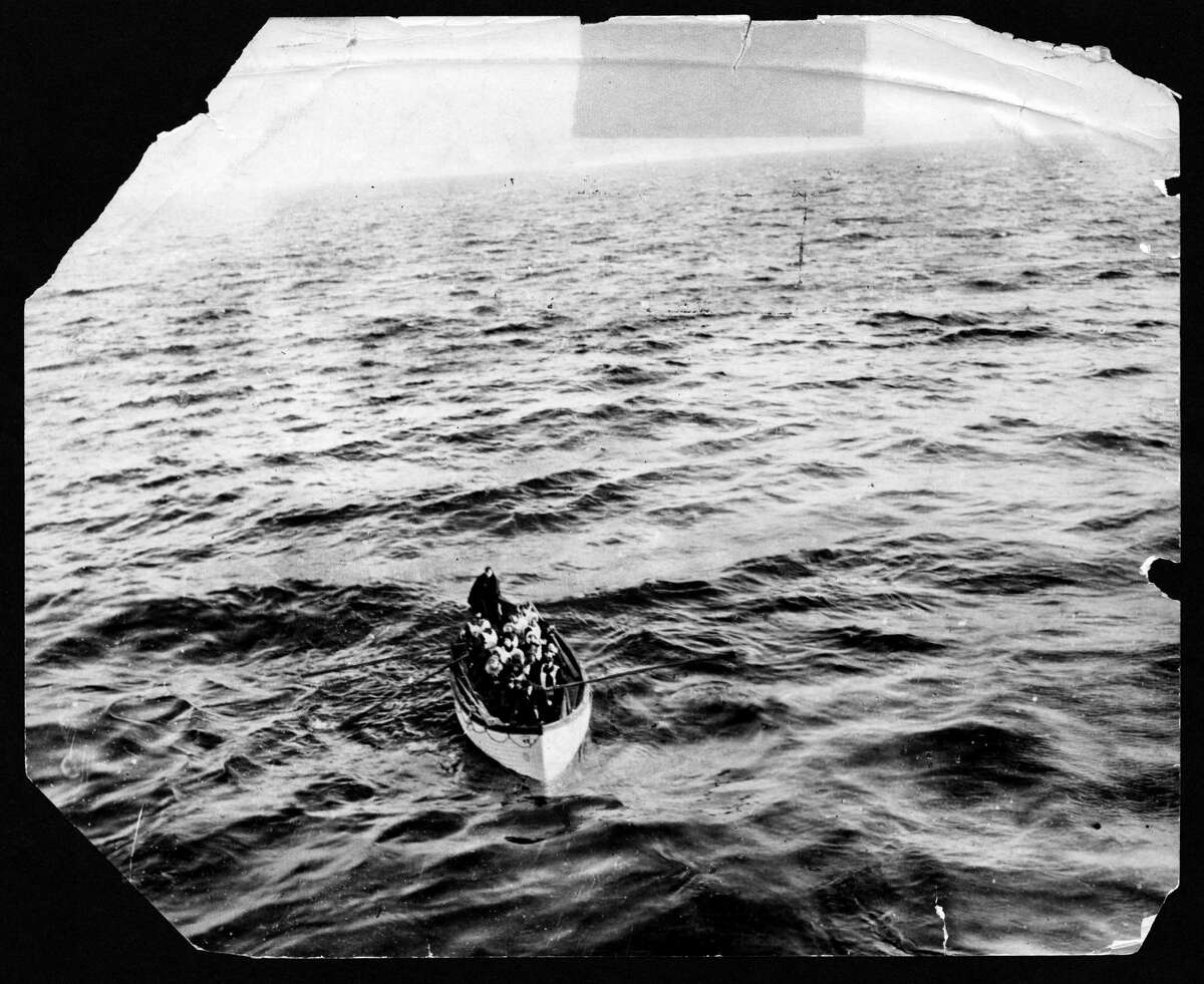 FILE -- Survivors of the sinking of the RMS Titanic approach the RMS Carpathia in this April 15, 1912 photo. The largest ship afloat at the time, the Titanic sank in the north Atlantic Ocean on April 15, 1912, after colliding with an iceberg during her maiden voyage from Southampton to New York City. (The New York Times)