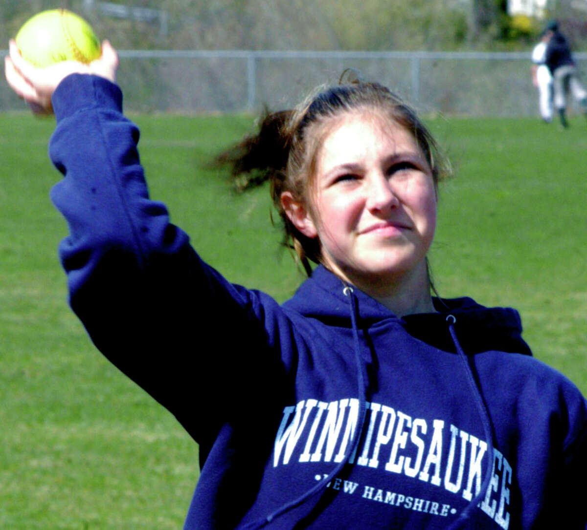 SPECTRUM/The Green Wave's Kim Carlson limbers up for New Milford HIgh School softball, April 2012.