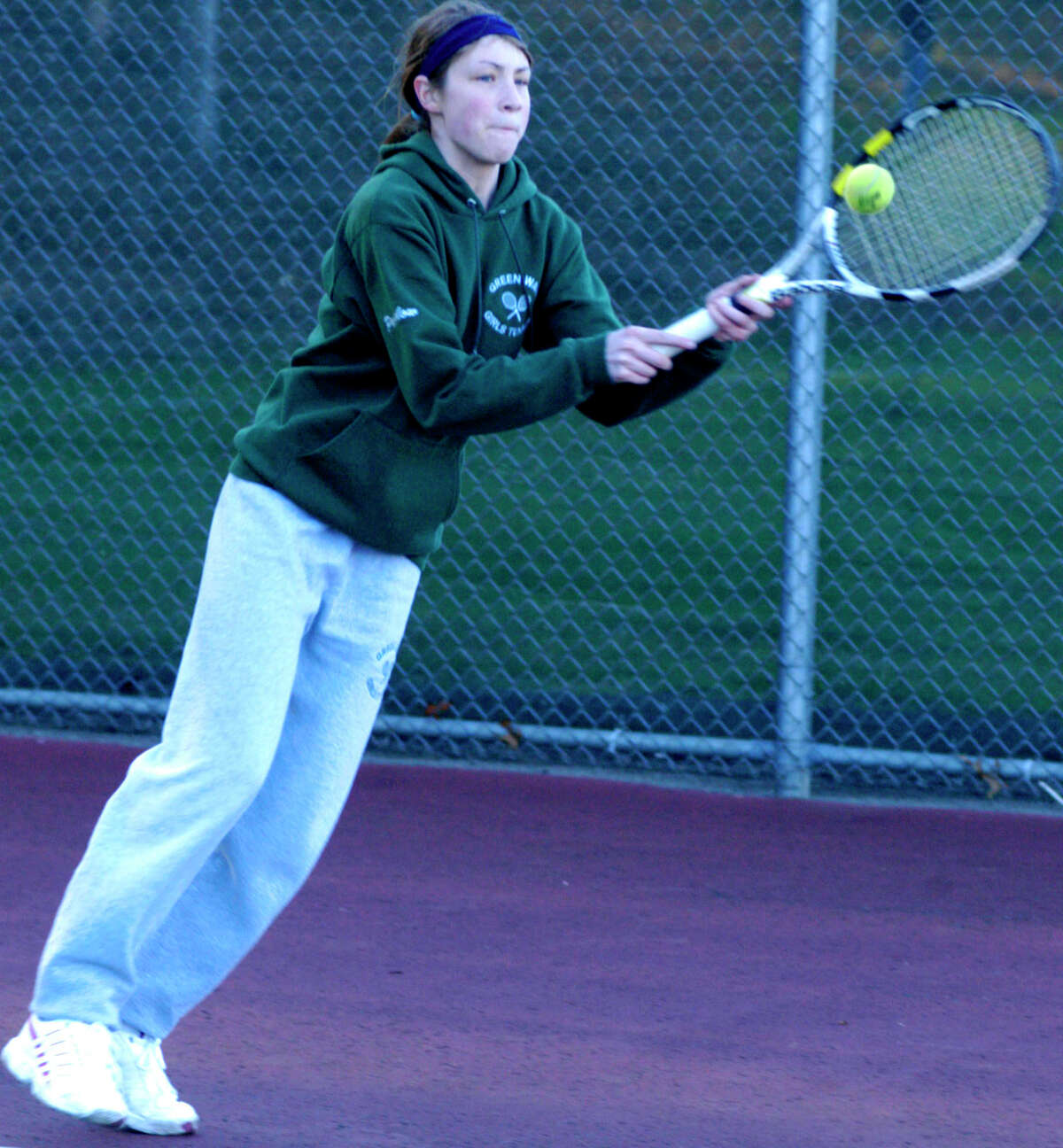 SPECTRUM/The Green Wave's Lindsey Partelow maintains her focus as she preps for the New Milford High School girls' tennis campaign. April 2012