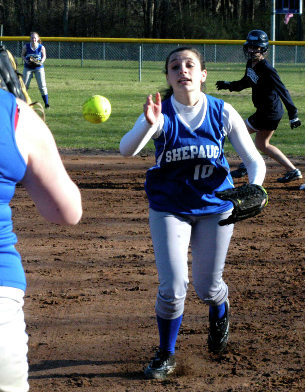 SPECTRUM/Spartan second baseman Kate DeWitte makes an accurate flip to first base to get a runner during pre-season for Shepaug Valley HIgh School softball, April 2012.