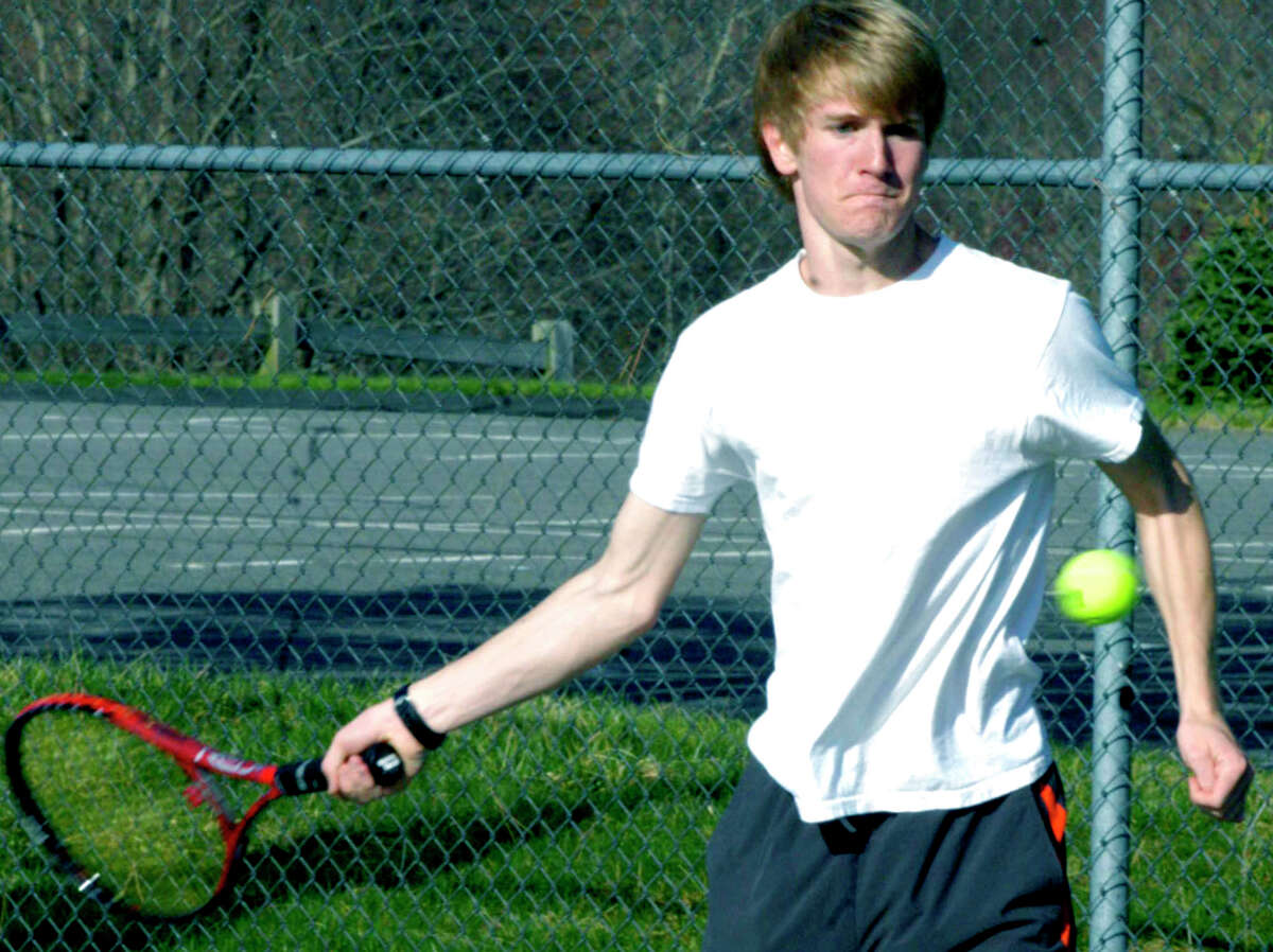 SPECTRUM/Ellery Rourk of the Spartans means business as he practices for the Shepaug Valley High School boys' tennis campaign. April 2012