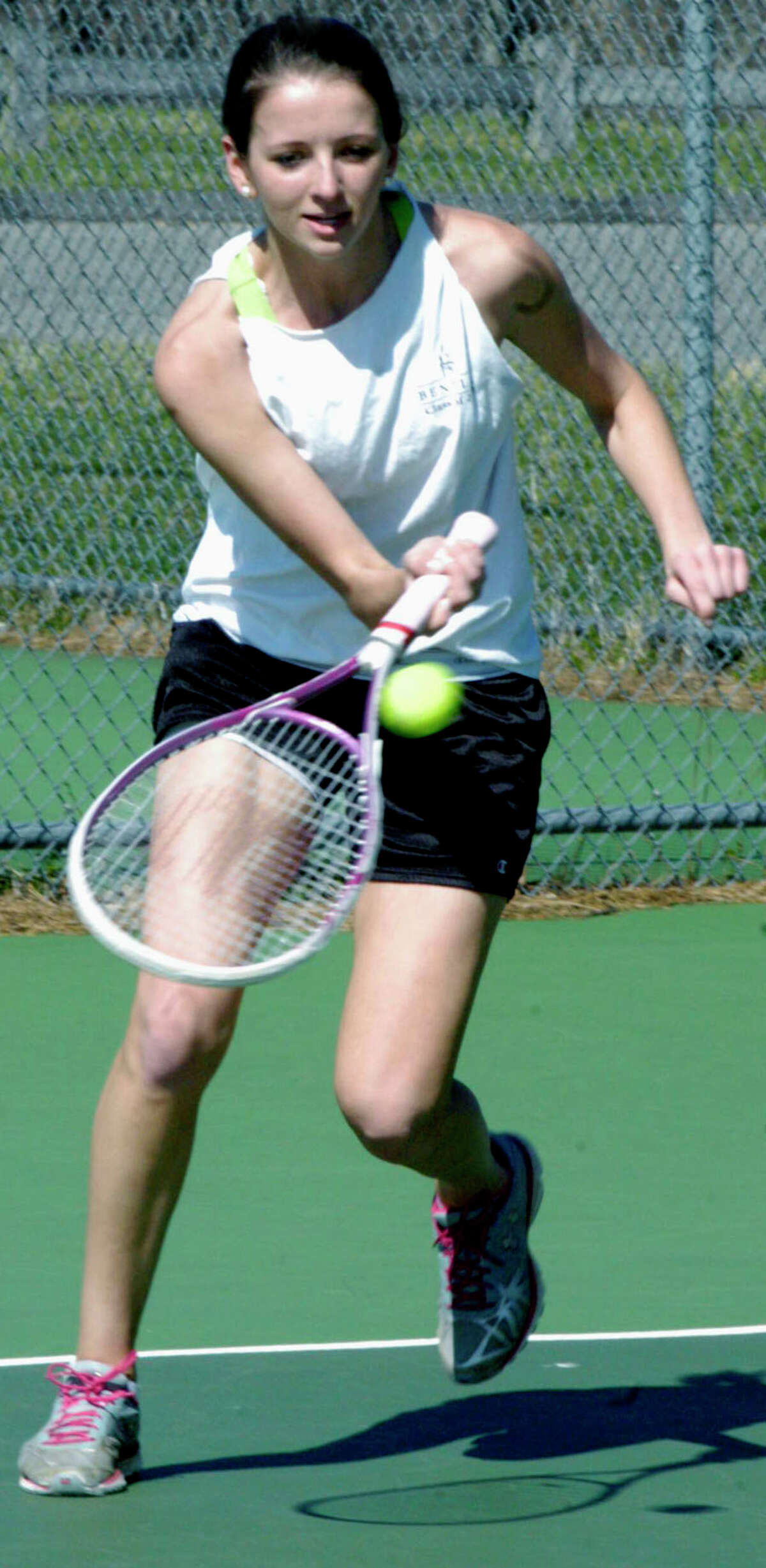 SPECTRUM/The Spartans' Colleen Koslosky demonstrates her mobility as she practices for the Shepaug Valley High School girls' tennis season. April 2012