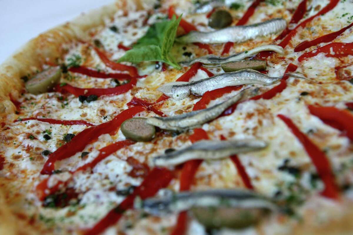 TASTE: Pizza from Il Sogno with anchovies. Il Sogno owner and Chef Andrew Weissman is this year's King Anchovy, photographed Tuesday April 10, 2012. Helen L. Montoya/San Antonio Express-News