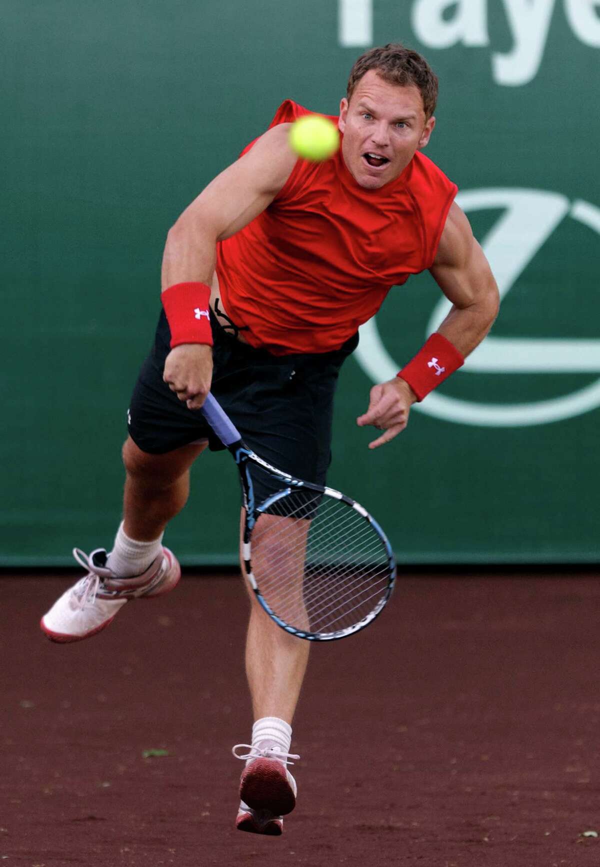Michael Russell serves to Igor Andreev in the first set during a US Mens Clay Court match on Monday, April 4, 2011 in Houston. Andreev won 6-2, 6-3.