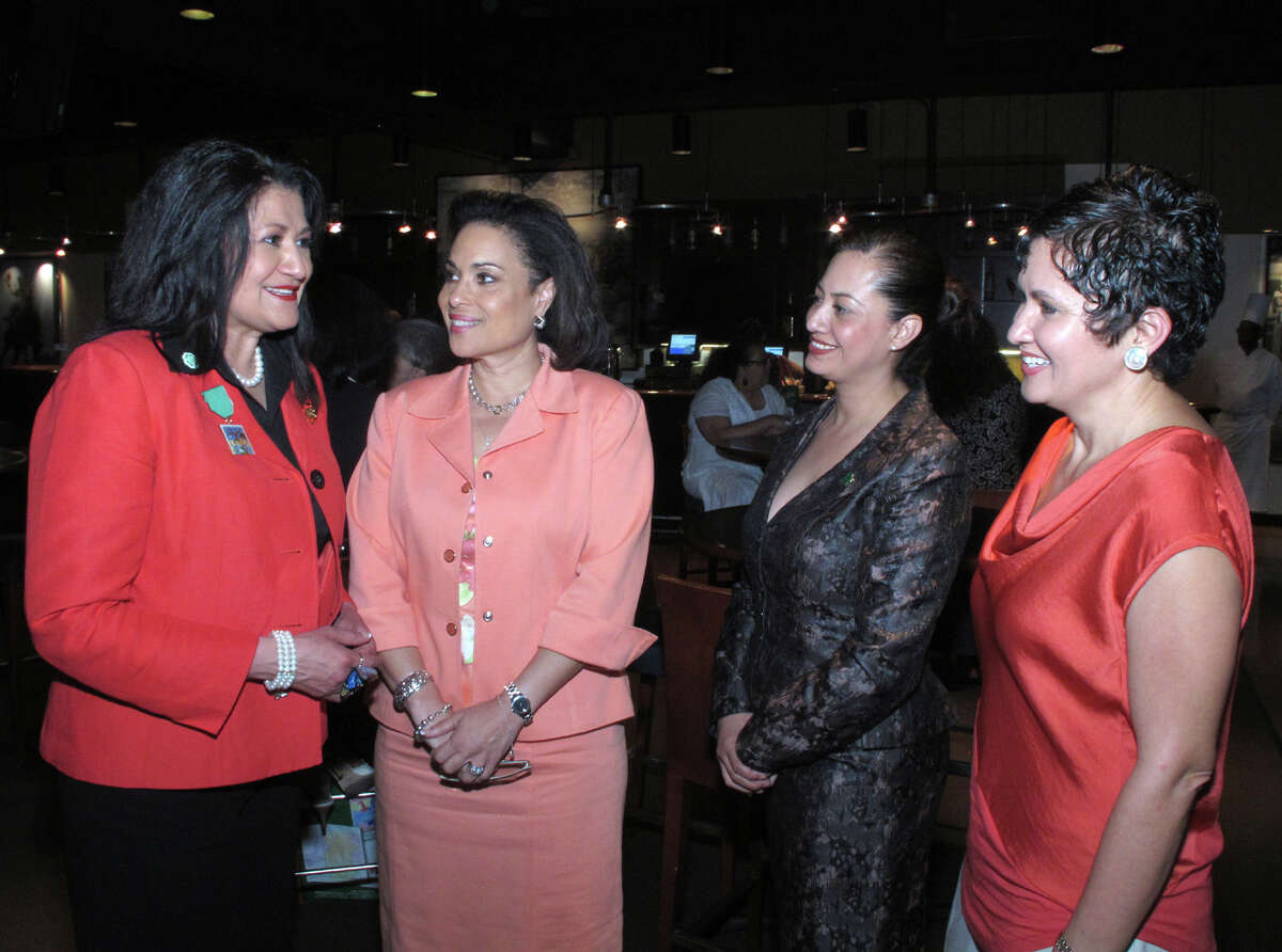 OTS/HEIDBRINK - Girl Scouts interim CEO Rose Gonzalez Perez, from left, and honorees Jelynne LeBlanc Burley, Janie Martinez Gonzalez and Lisa Sanchez-Wong mingle at the Girl Scouts of Texas 100th anniversary at the AT&T Center on 4/5/2012. names checked photo by leland a. outz