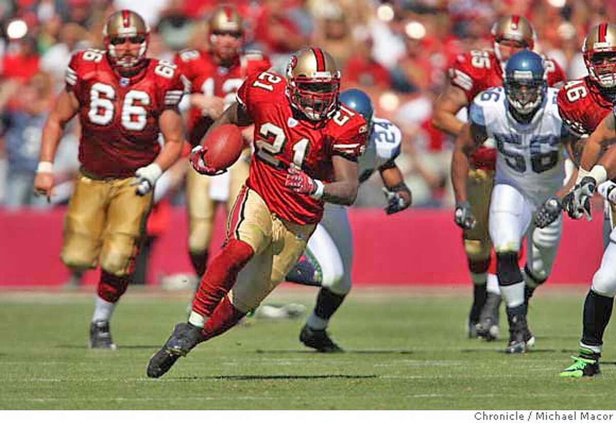 San Francisco 49ers Frank Gore (21) with a first down run in the 2nd quarter. The San Francisco 49ers vs. the Seattle Seahawks. Photographed in, San Francisco, Ca, on 9/30/07. Photo by: Michael Macor/ The Chronicle