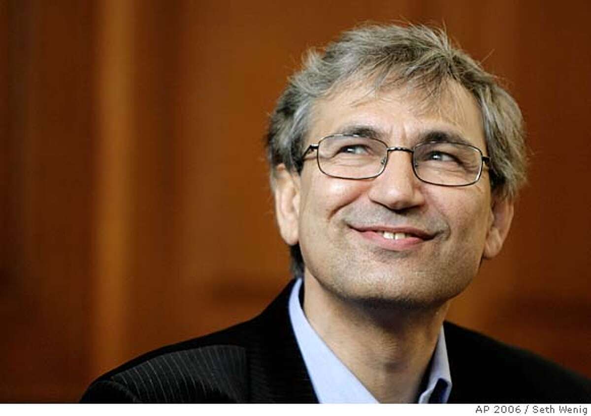 Turkish novelist Orhan Pamuk appears at a news conference in New York, Thursday, Oct. 12, 2006. Pamuk, an international symbol of literary and social conscience, whose poetic, melancholy journeys into the soul of his native Turkey have brought him the many blessings and burdens of public life, won the Nobel literature prize Thursday. (AP Photo/Seth Wenig) Ran on: 10-13-2006 Ran on: 10-13-2006