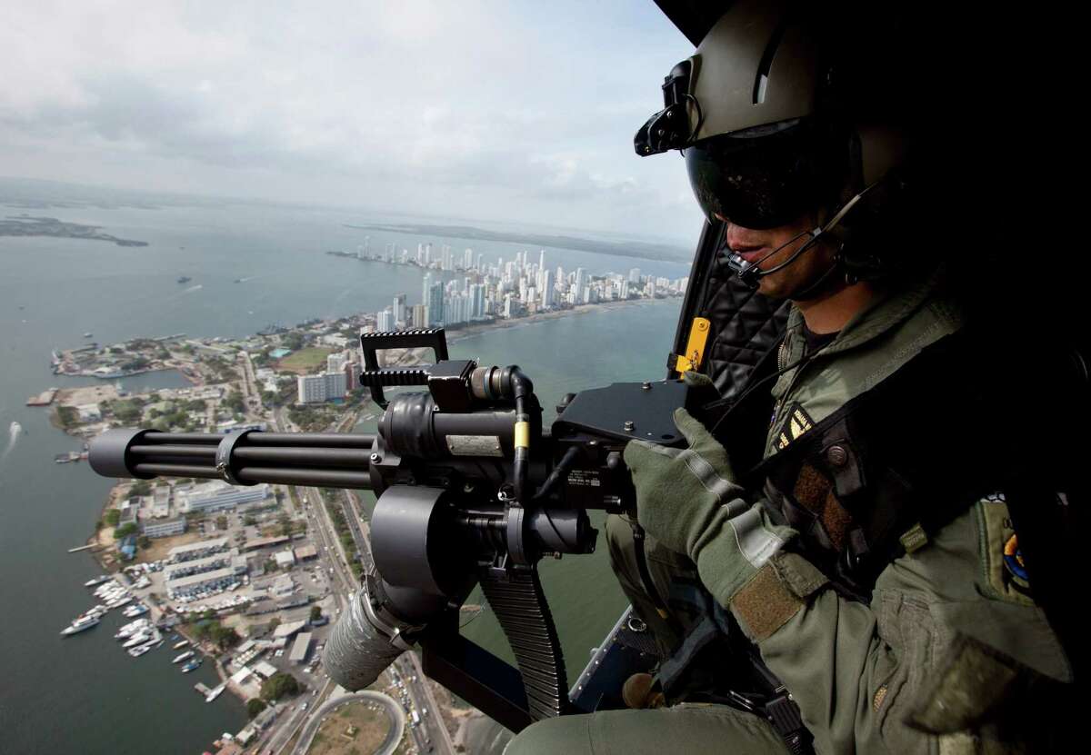 A navy helicopter patrols Thursday over Cartagena, Colombia. Thirty-three of 35 Western Hemisphere leaders will gather for the sixth Summit of the Americas in the colonial-era port this weekend.