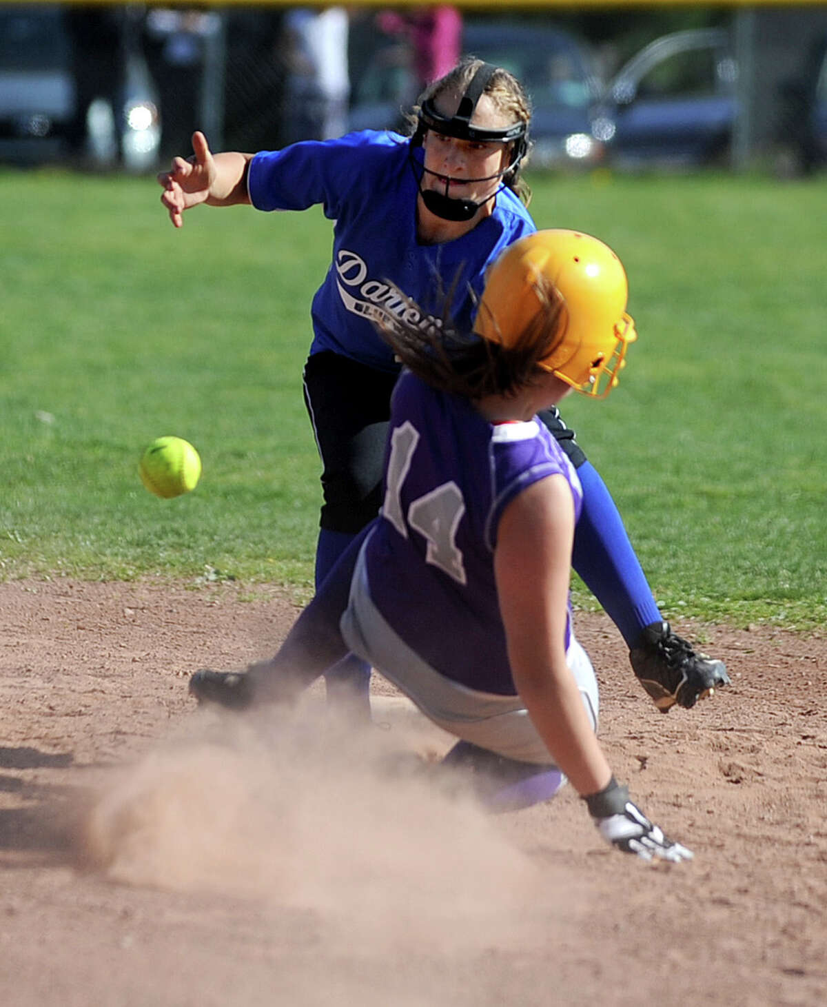Darien's Erika Osherow reaches for the ball as Westhill's Cassandra Kish slides into second base during Friday's softball game at Westhill High School in Stamford on April 13, 2012.