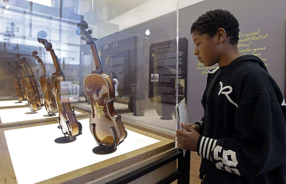 Restored violins bear sound, remembrance of Holocaust