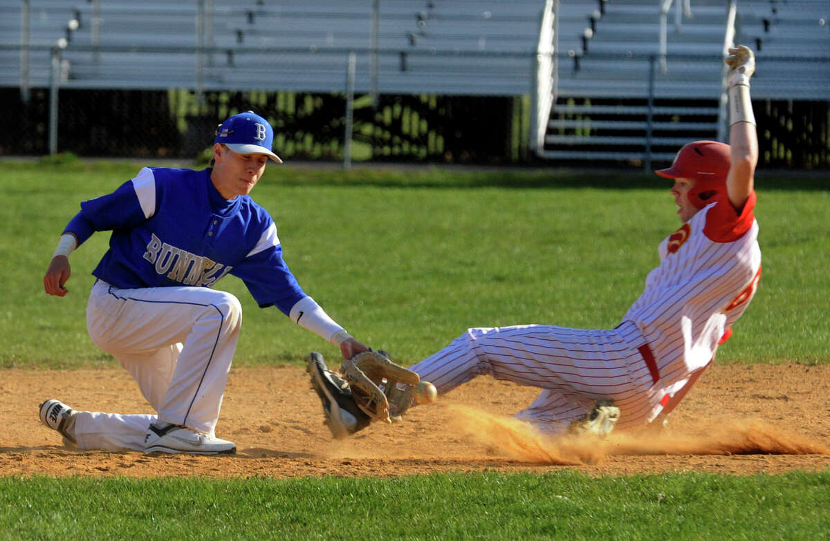 during boys baseball action in Stratford, Conn. on Friday April 13, 2012.