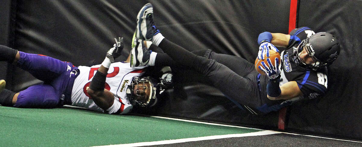 Talons receiver Robert Quiroga stretches into the end zone after beating Jeremy Kellem on a pass to the left side as the San antonio Talons host the New Orleans Voodoo at the Alamodome on April 13, 2012. Tom Reel/ San Antoniopress-News