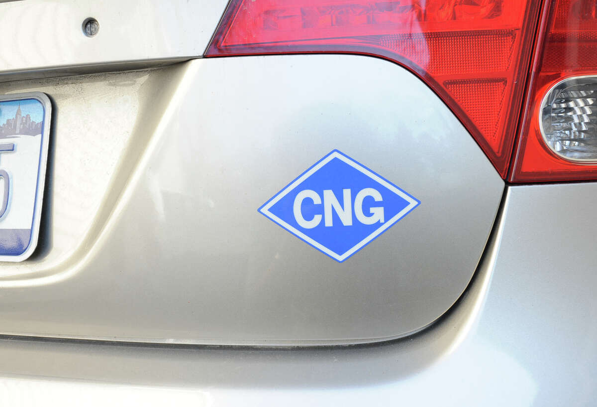 A sticker on a Honda Civic shows that it uses compressed natural gas in this file photo from 2012. A Houston CNG station is one of 11 in several states acquired in December 2016 by American Natural Gas. 