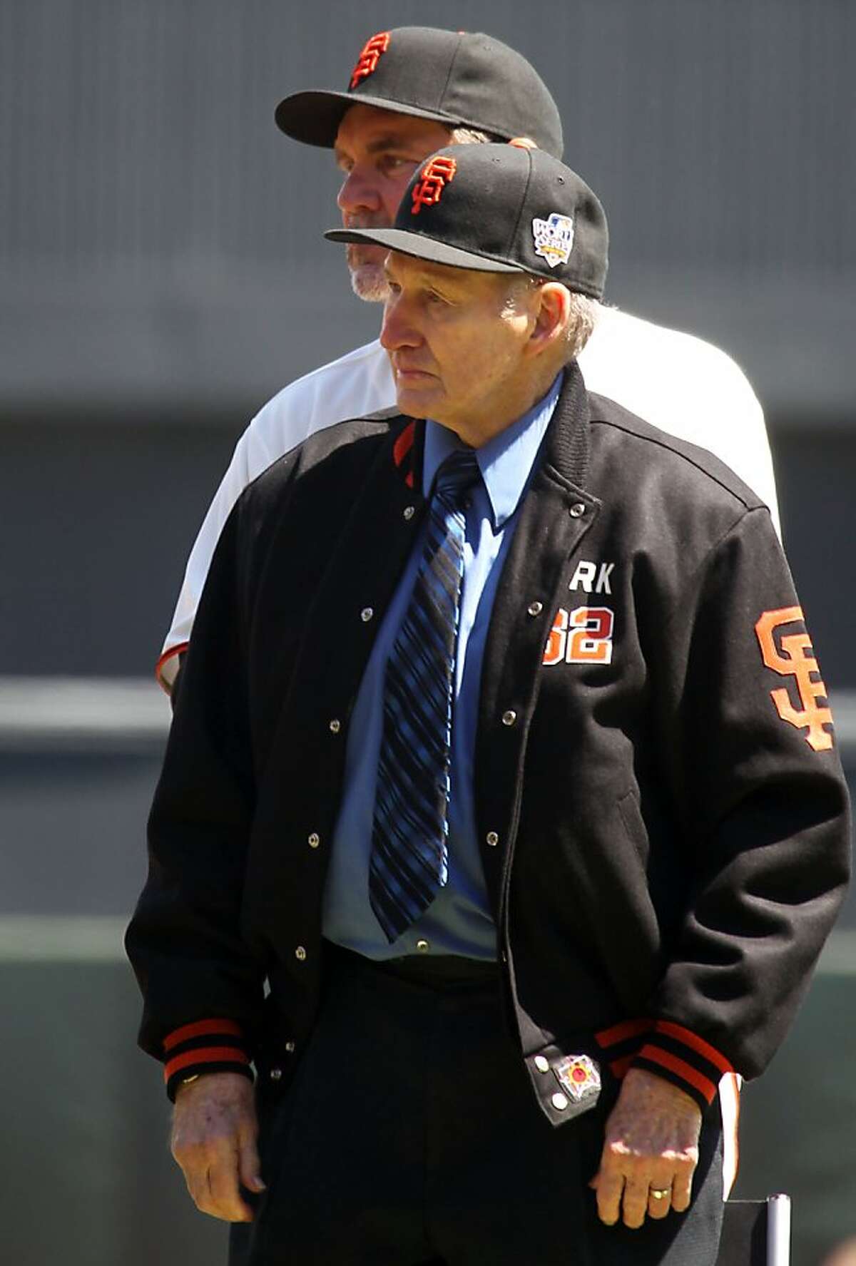 San Francisco Giants Manager Bruce Bochy, rear, stands with former New York Giants manager Alvin Dark, who led the 1961-63 team when they won the pennant. Members of that team were honored Friday April 13, 2012, prior to the start of the Giants and Pittsburgh Pirates game on opening Day in San Francisco. Giants won 5-0.