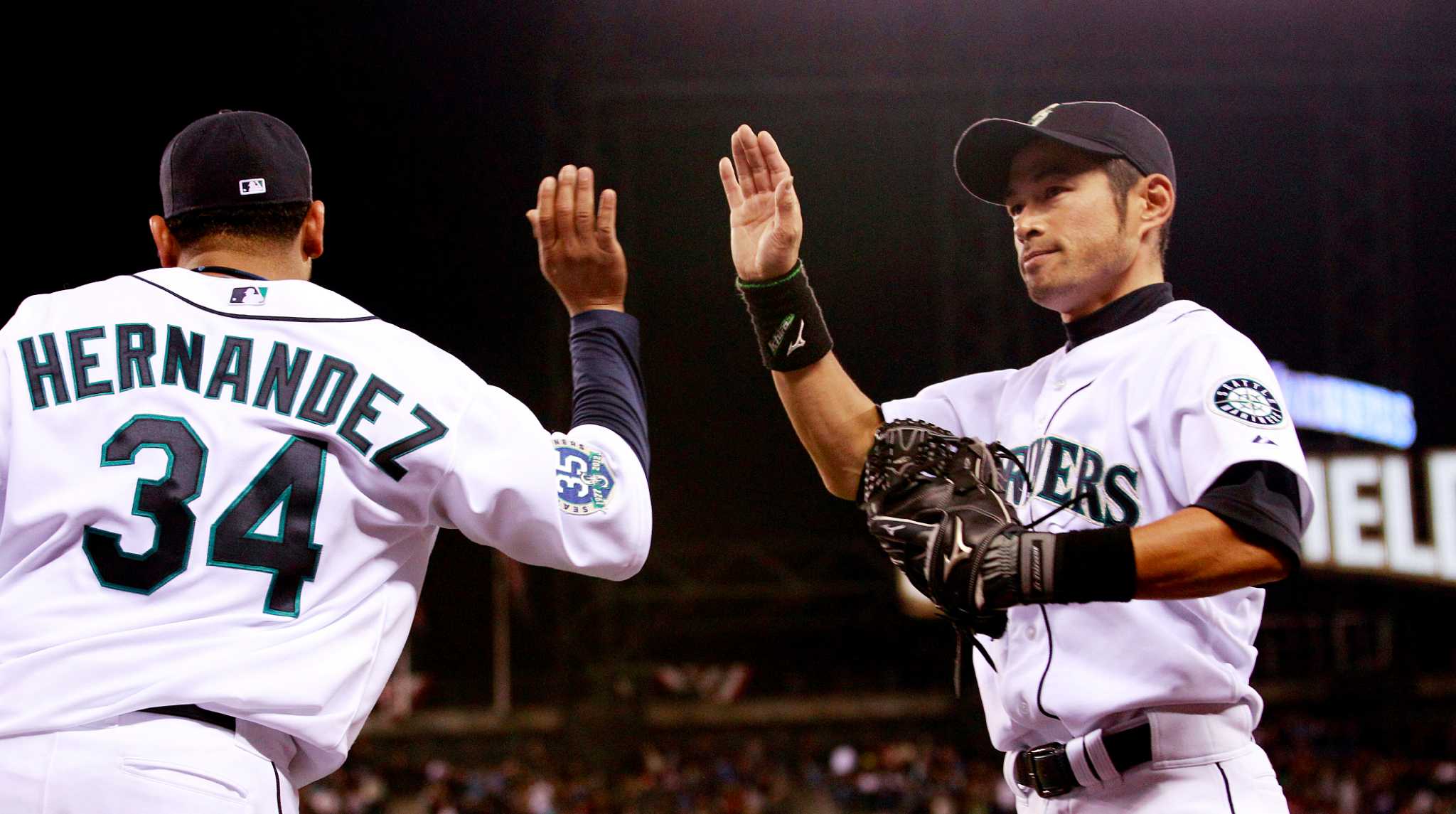 Seattle Mariners pitcher Felix Hernandez is greeted by teammates after he  threw a perfect baseball game against the Tampa Bay Rays, Wednesday, Aug.  15, 2012, in Seattle. (AP Photo/Ted S. Warren Stock