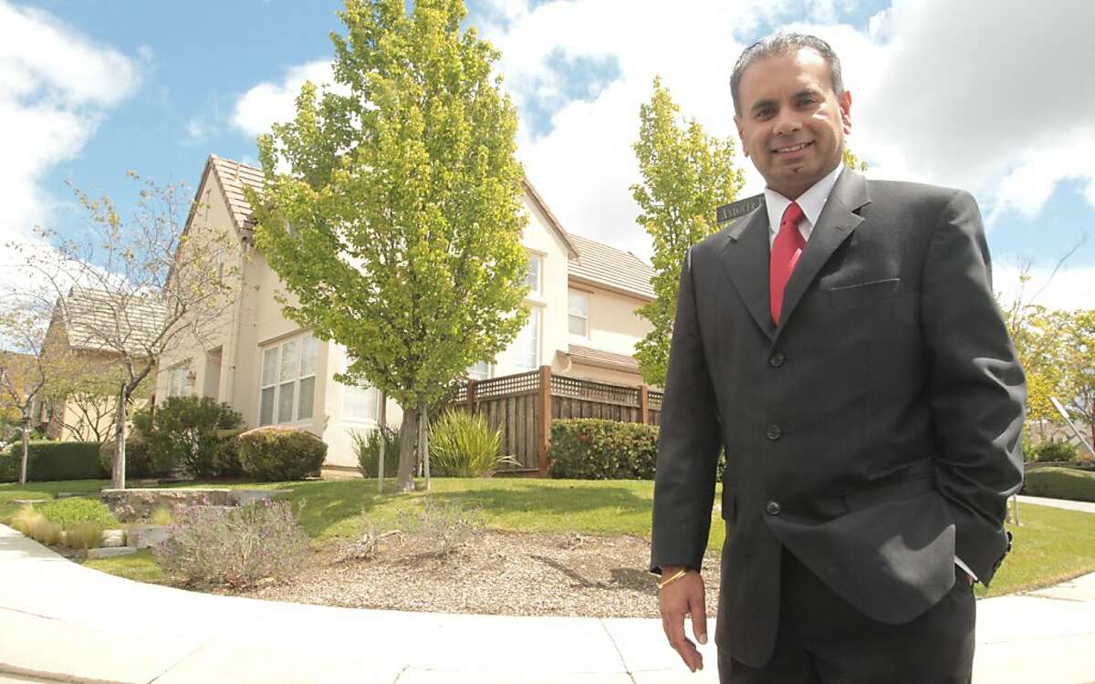 Jagdip Nirwan, a board member of the homeowners association for The Village at Hiddenbrooke, stands in the Thomas Kinkade housing development on Friday, April 13, 2012, in Vallejo, Calif.