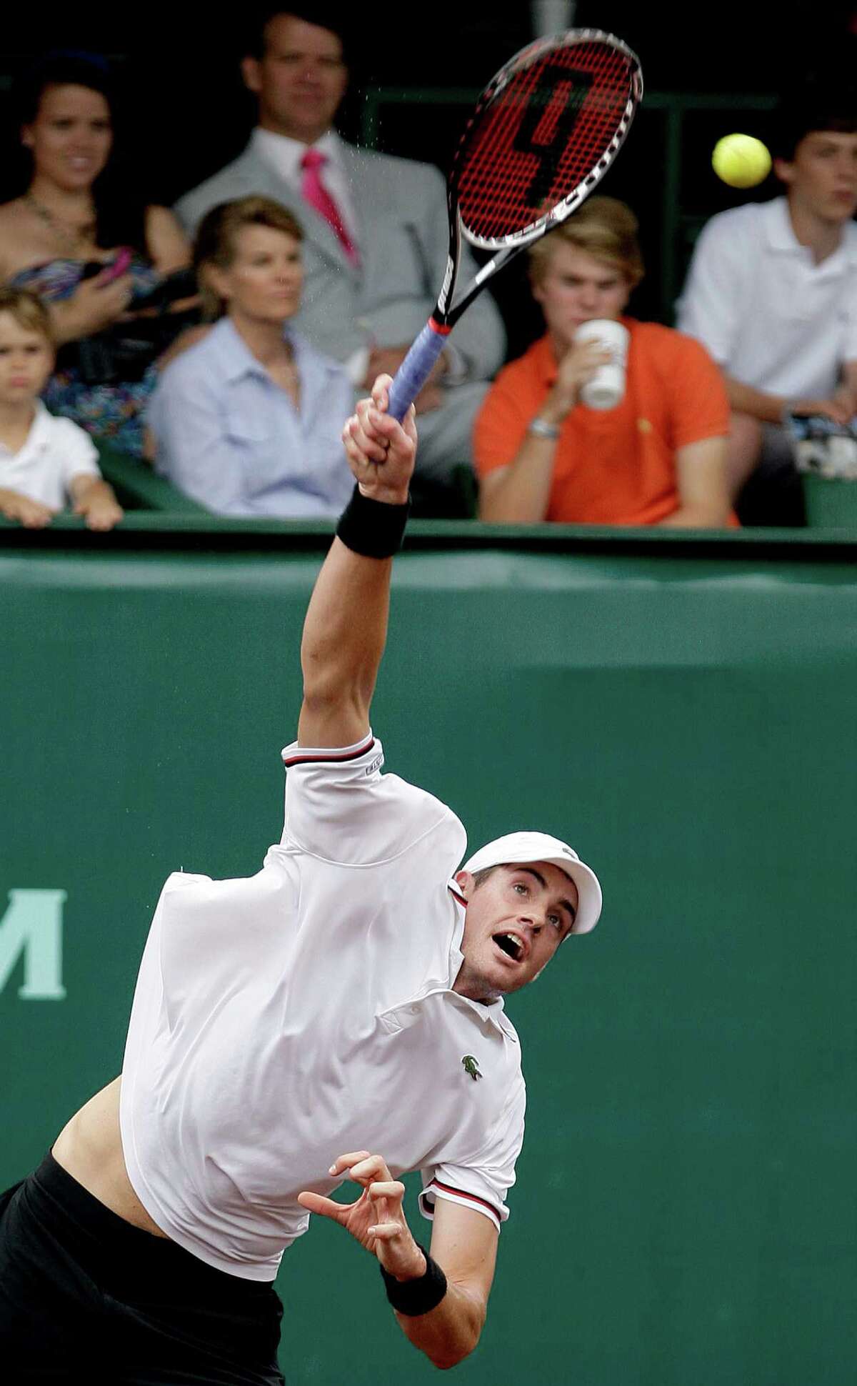 4/14/2012 : John Isner serves against Feliciano Lopez in the singles clay court semi finals at River Oaks Country Club in Houston, Texas. For the Chronicle: Thomas B. Shea