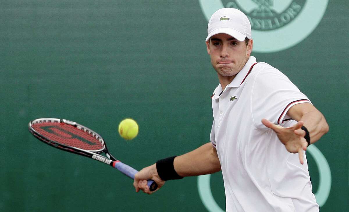4/14/2012 : John Isner returns a serve against Feliciano Lopez in the singles clay court semi finals at River Oaks Country Club in Houston, Texas. For the Chronicle: Thomas B. Shea