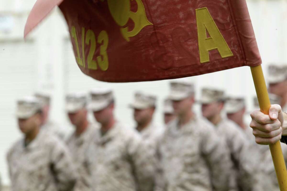 The flag of the 1st Battalion, 23rd Marine Regiment, Alpha Company is displayed during a medal presentation ceremony at Ellington Field Joint Reserve Base April 14, 2012, in Houston. Smith, 26, of Arlington, with the 1st Battalion, 23rd Marine Regiment, was killed in a friendly fire incident involving a U.S. Predator drone in Afghanistan's Helmand Province on April 6, 2011.