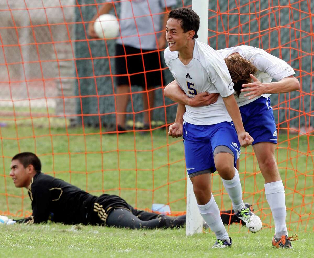 Jesus Espin (left) is congratulated by Alamo Heights teammate Matthew Struble after scoring a goal against Pharr Valley View's Javier Olvera on Saturday.