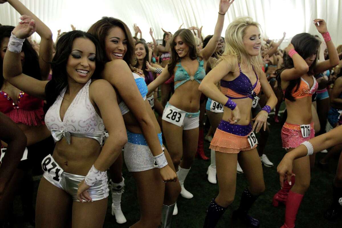 Contestants dance together during the Texans' cheerleader tryouts in the Texans' practice bubble at Reliant Park Saturday, April 14, 2012, in Houston. More than 900 women registered to tryout. There is a range of 25 to 35 that will be selected. The group will be cut to 100 for the second round. Finals will be held on draft day.