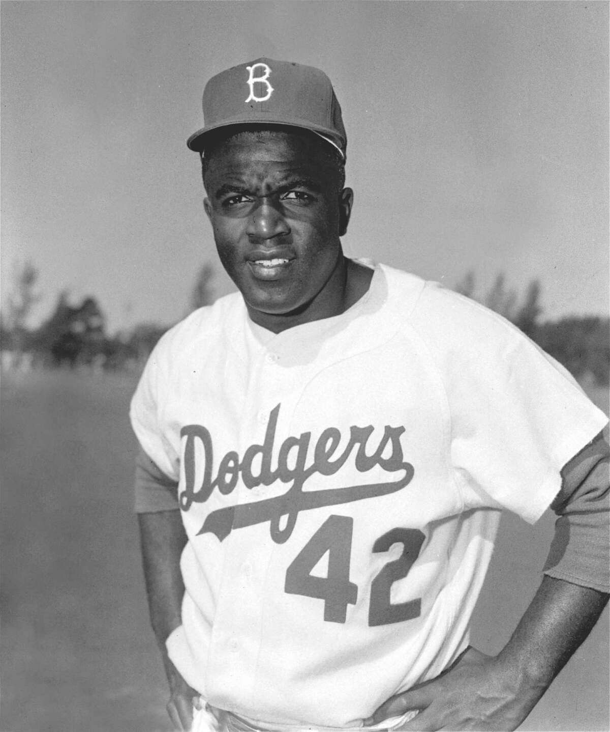 Jackie Robinson, former Brooklyn Dodger infielder, is shown in this March, 1956 file photo. Robinson will be nominated for the Congressional Gold Medal in recognition of his achievements as the first black player in Major League Baseball, the Boston Red Sox said. (AP Photo, File) HOUCHRON CAPTION (06/26/2004): ROBINSON.