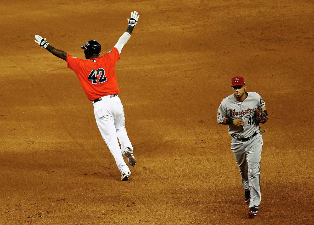 Hanley Ramirez of the Miami Marlins celebrates hitting a bases loaded walk off single in the 11th inning during a game against the Houston Astros at Marlins Park on April 15, 2012 in Miami, Florida. Both teams wore the number 42 in honor of Jackie Robinson Day.