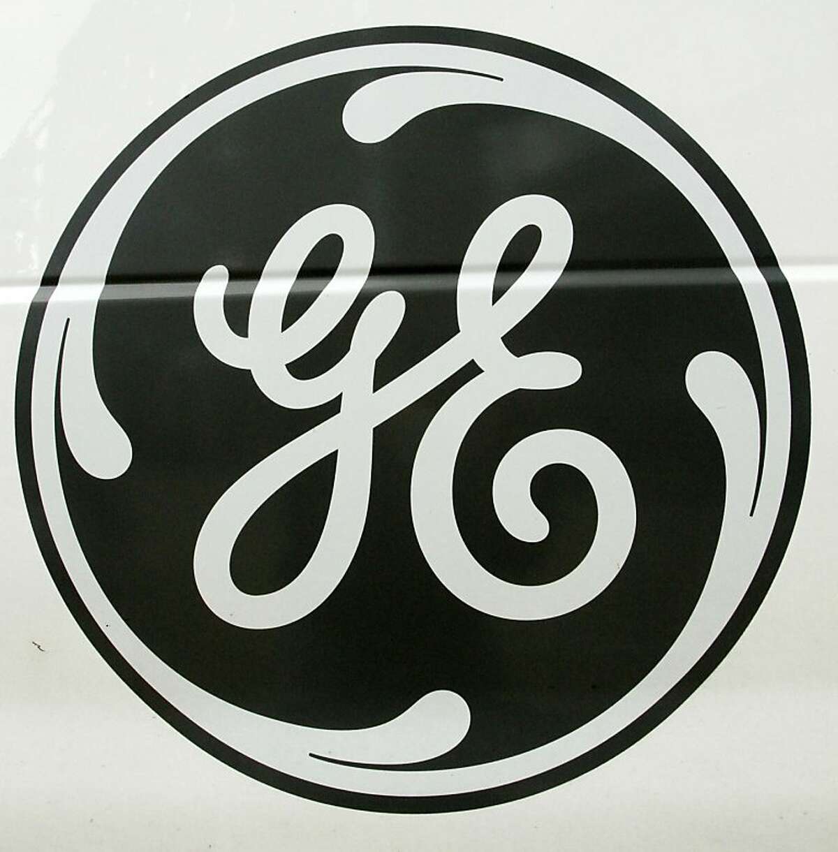 The General Electric logo is seen on the side of an appliance repair van, Friday, Oct. 15, 2010, in a Pittsburgh Home Depot store. The industrial and financial giant said that sales of industrial equipment, everything from wind turbines to jet engines tolocomotives, lagged in the third quarter.