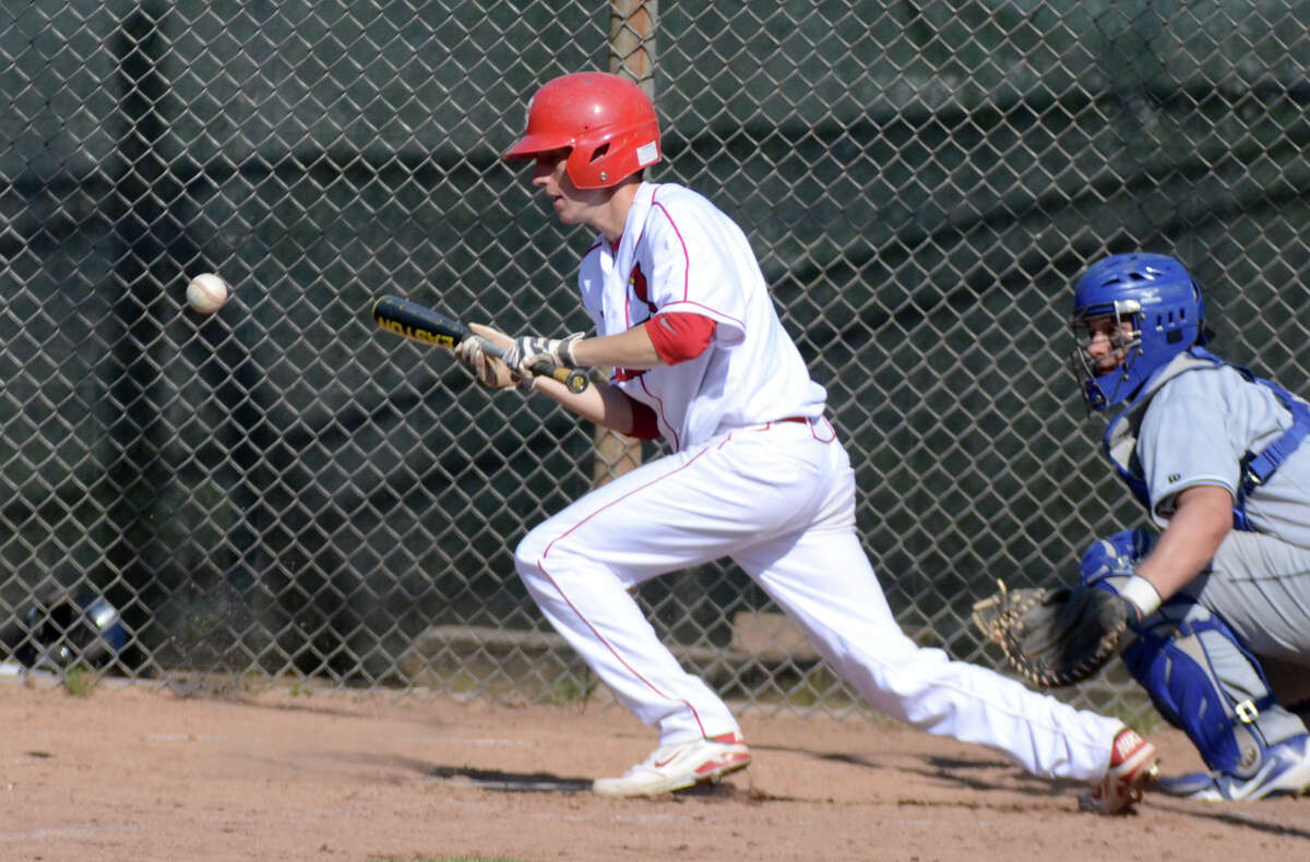 Greenwich's David Berdoff (6) bunts during the baseball game against Wilton at Greenwich High School on Monday, Apr. 16, 2012.
