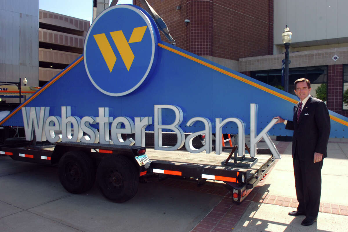 James C. Smith, Chairman, President and Chief Executive Officer Webster Bank and Webster Financial Corporation poses next to part of the Webster Bank sign before it is lifted into place on the Webster Bank Arena at Harbor Yard in Bridgeport, Conn. May 12th, 2011.