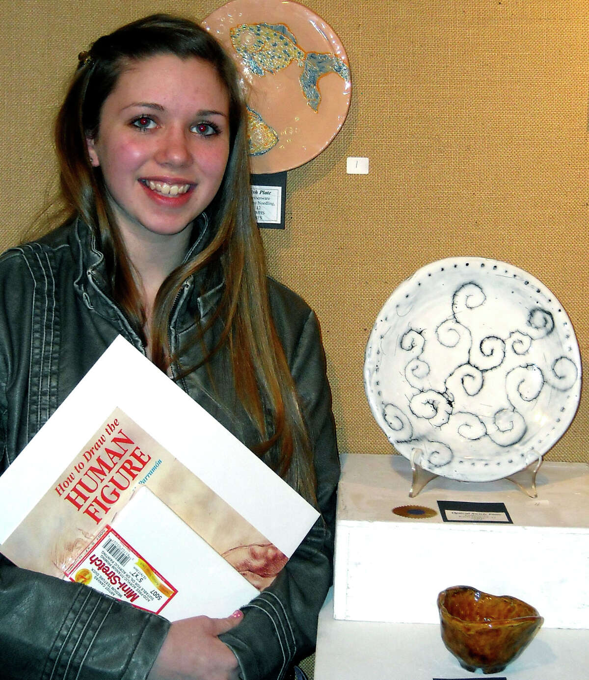 SPECTRUM/Twenty art students from New Milford High School recently participated in the Kent Art Association student show. Two were awarded prizes: senior Kayla Marlowe, above, who won an award for a wax resist plate, and freshman Taryssa Killian for a pastel. Courtesy of New Milford High School