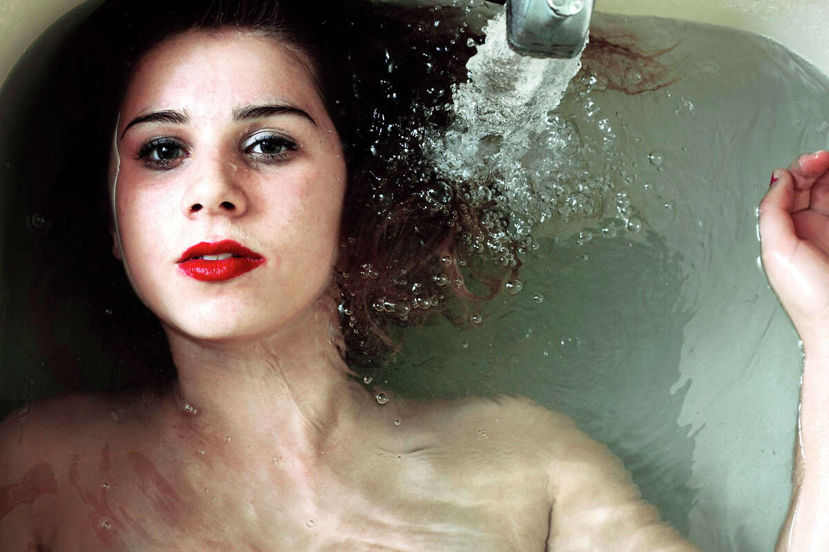 SPECTRUM/A photograph taken by New Milford High Schol senior Morgen Purcell was recently selected as a finalist in Photographers Forum Magazine 2012 Photography contest, open to high school and college students. Her photograph, ìBrianna in the Tub,î was chosen from 18,000 entries nationwide. Winners will be published in the April edition of the magazine and in the pages of a hardcover book by the same name. Morgen is a student of Annette Marcus in AP Studio Art. Courtesy of New Milford High School